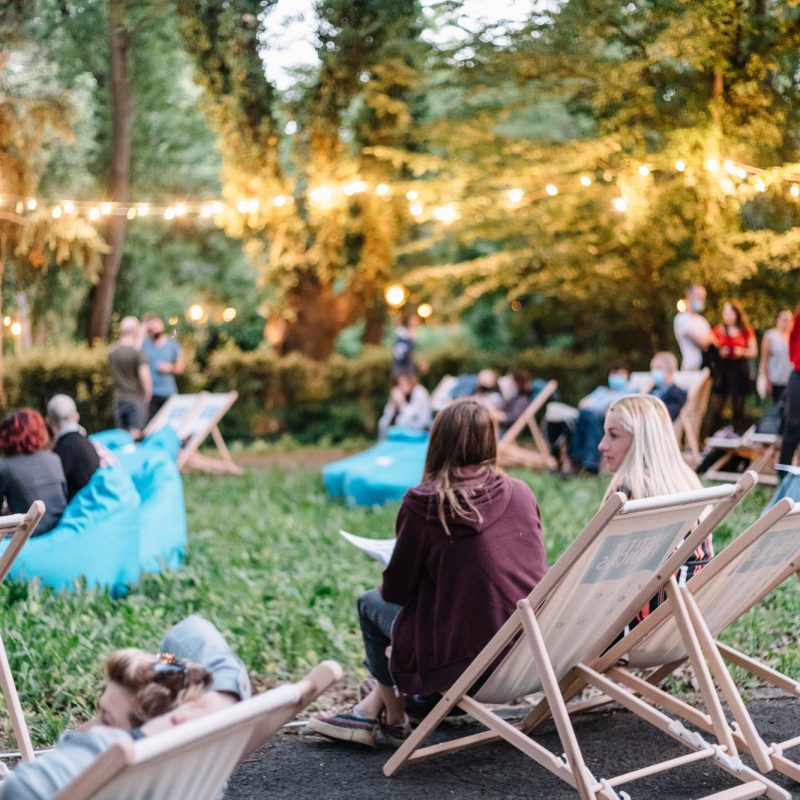 Candid moment at a social event-movie night in the garden.