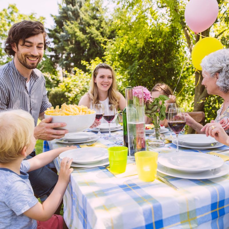 Family of three generations at a garden party